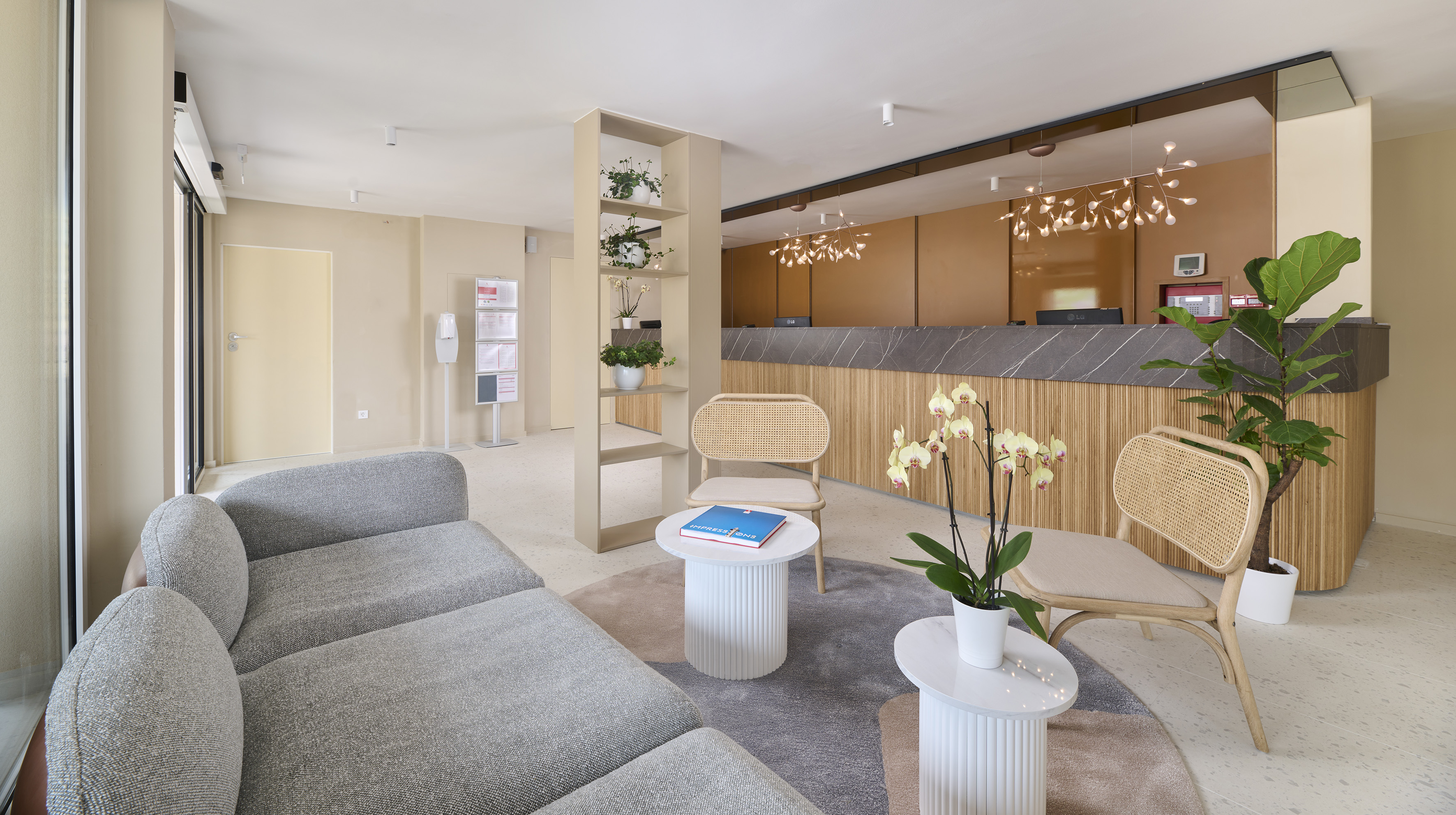 a room with a couch and chairs