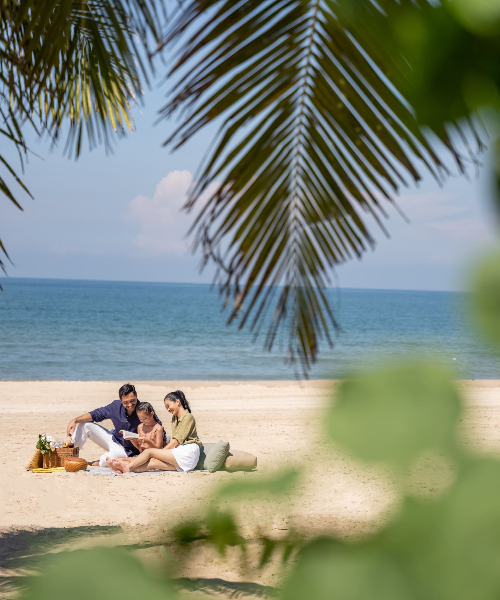 a group of people sitting on a beach