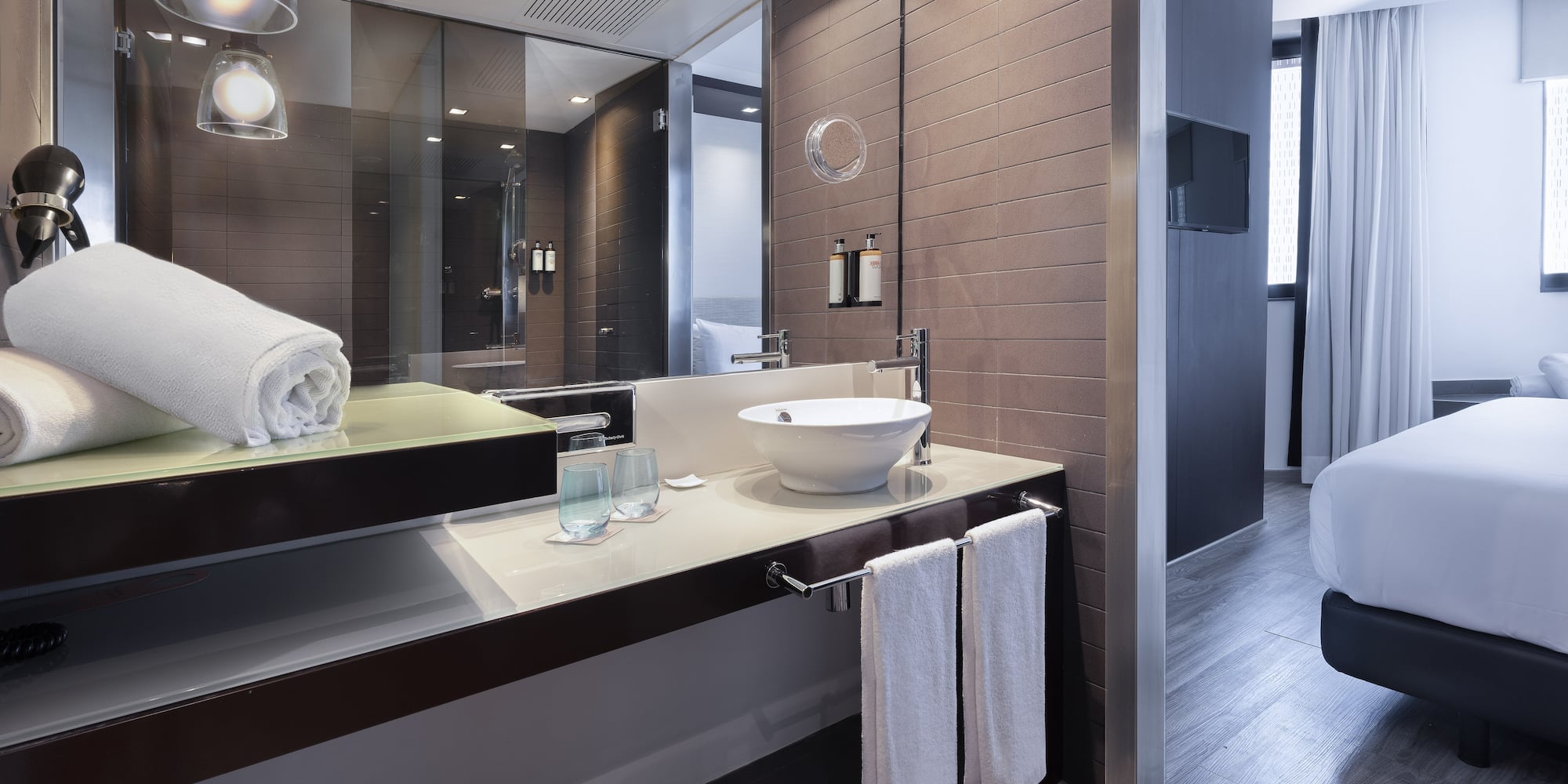 a bathroom with a mirror and sink