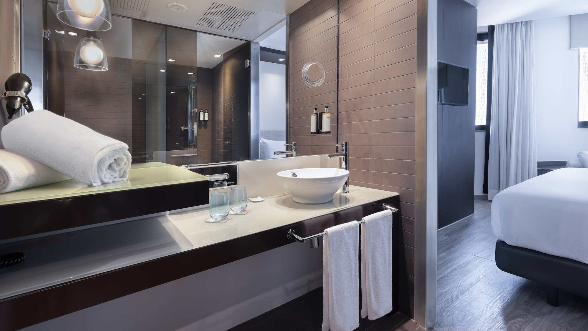 a bathroom with a mirror and sink