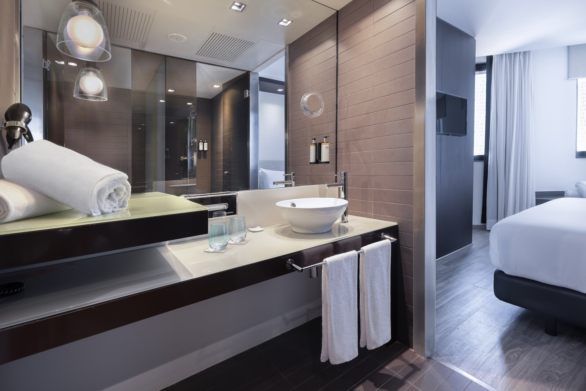 a bathroom with a mirror and sink