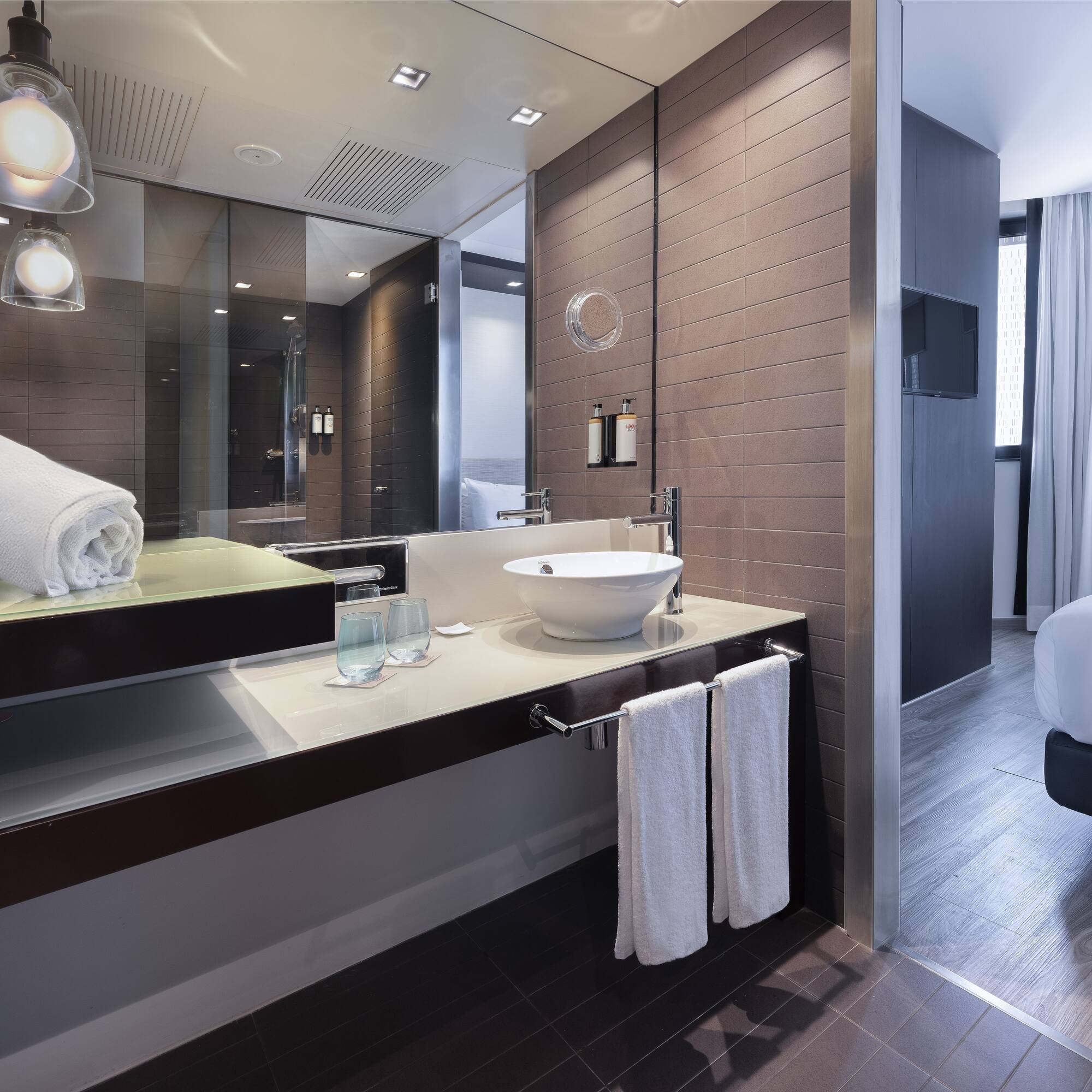 a bathroom with a mirror and sink