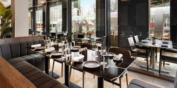 a restaurant with tables and chairs