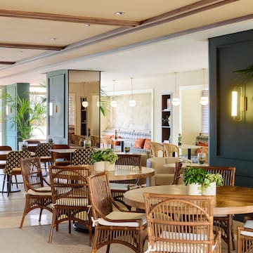 a room with tables and chairs