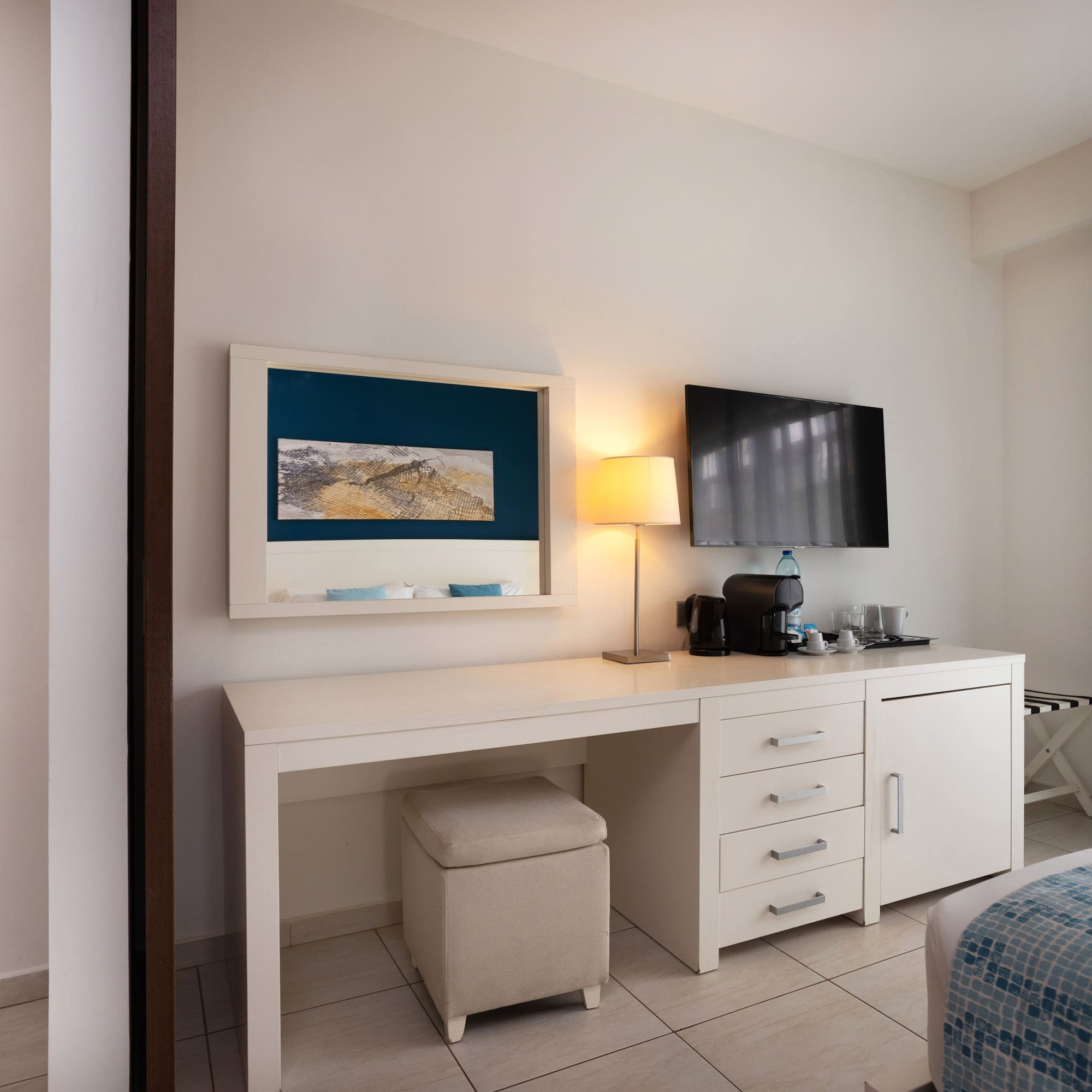 a room with a desk and a television