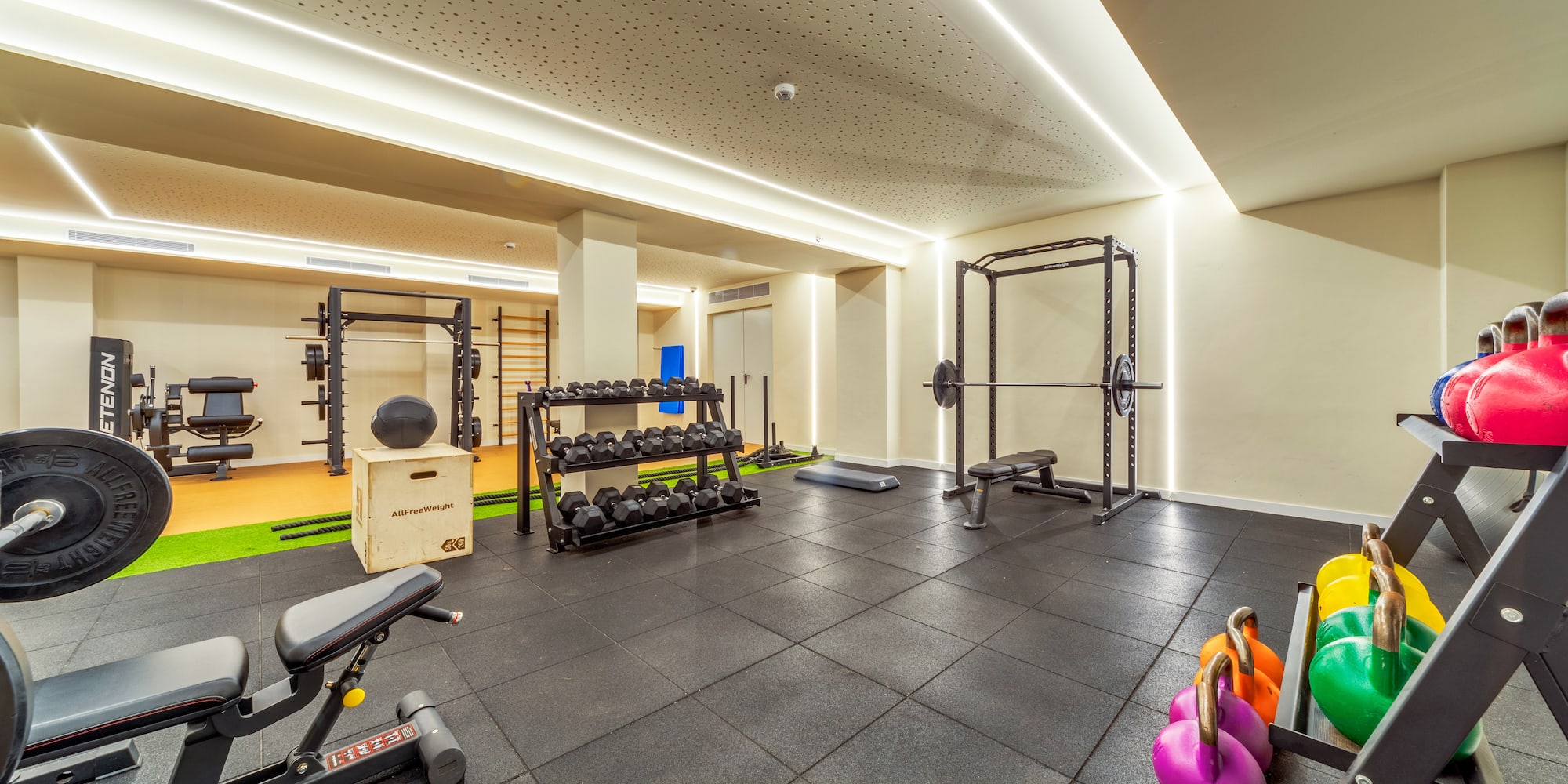 a gym with weights and equipment