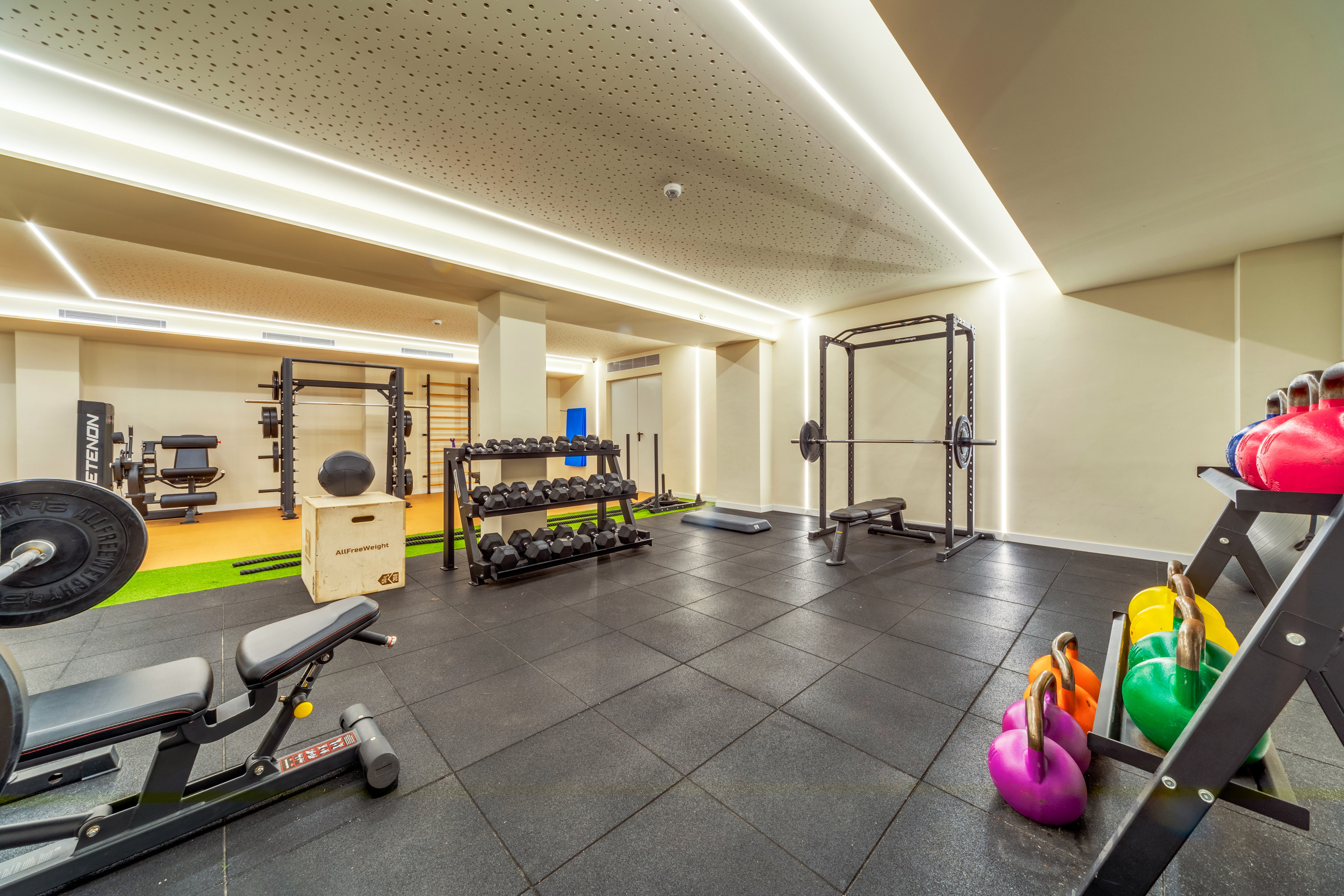 a gym with weights and equipment