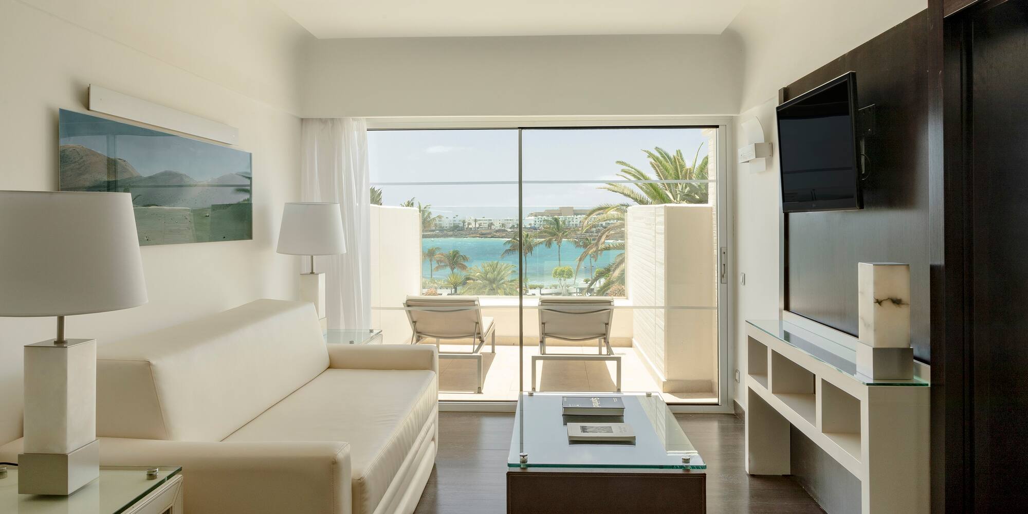 a living room with a television and a couch