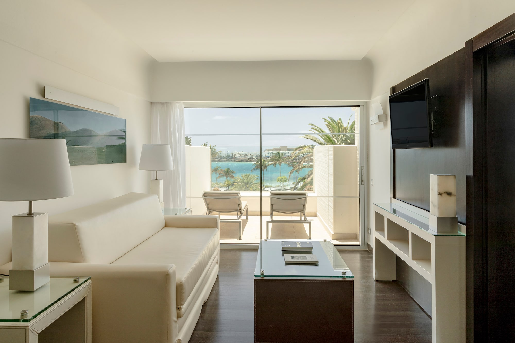 a living room with a television and a couch