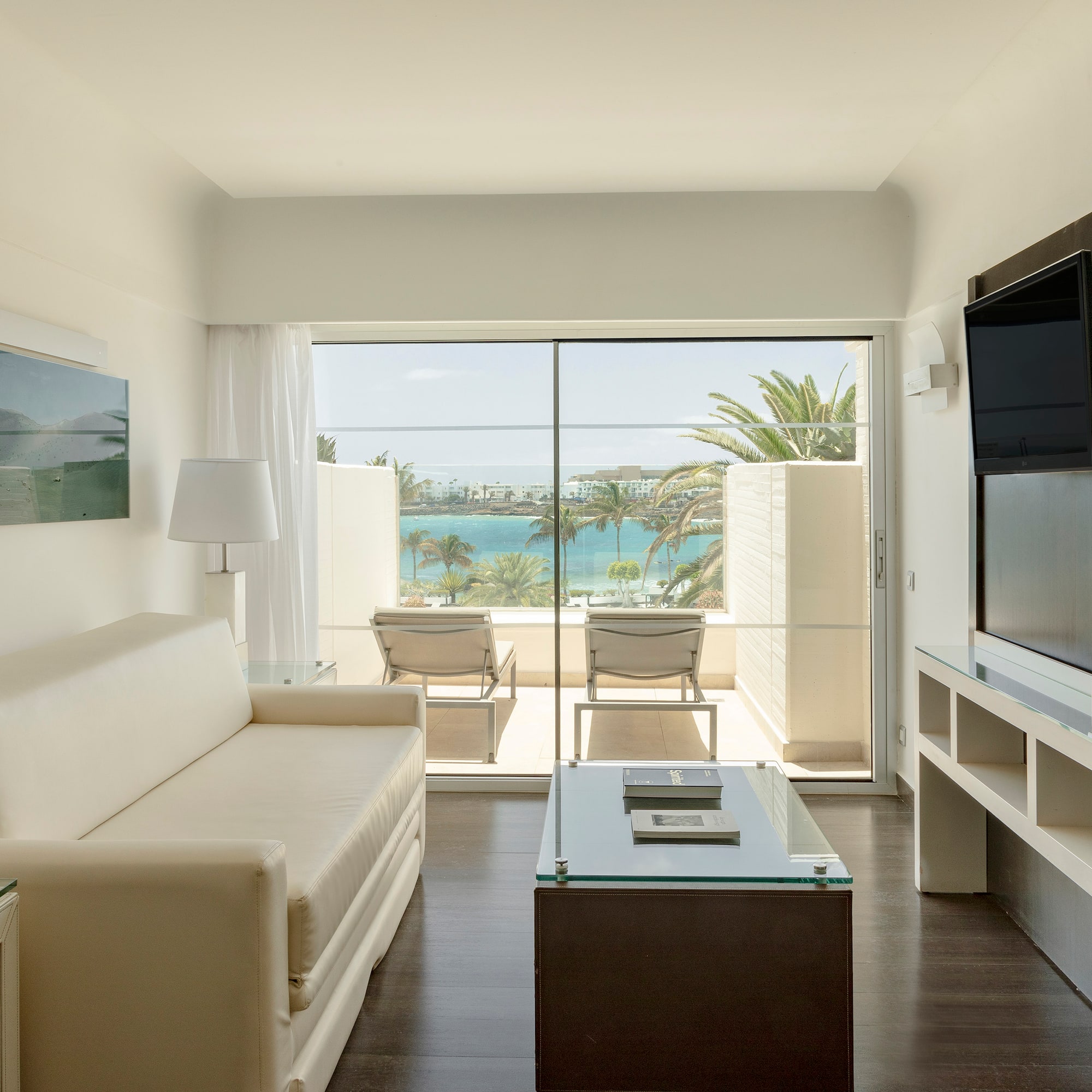 a living room with a television and a couch