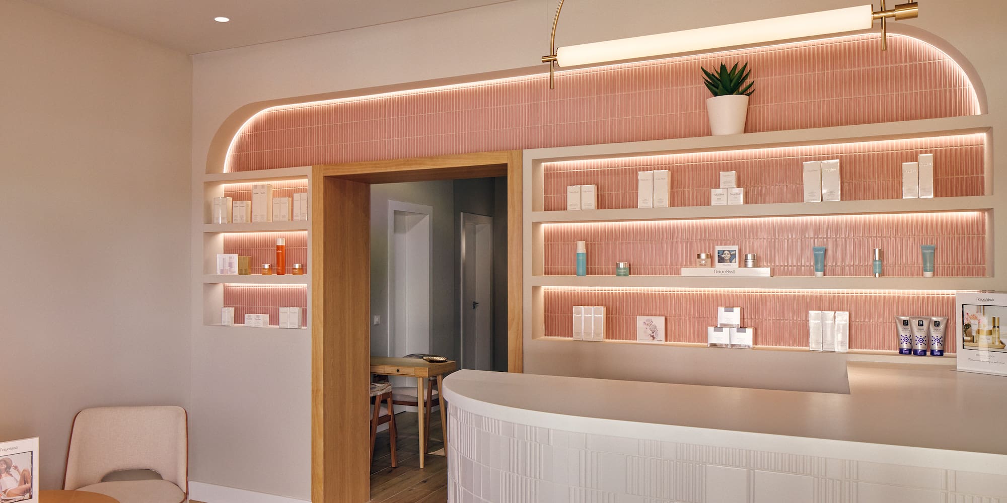 a room with a reception desk and shelves