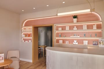 a room with a reception desk and shelves