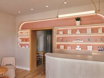 a room with a reception desk and shelves