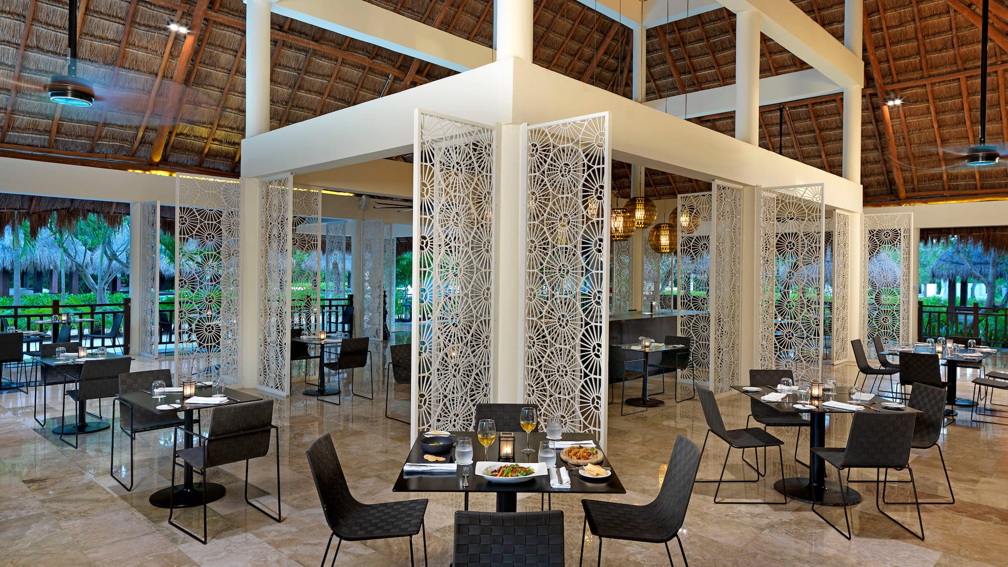 a restaurant with tables and chairs