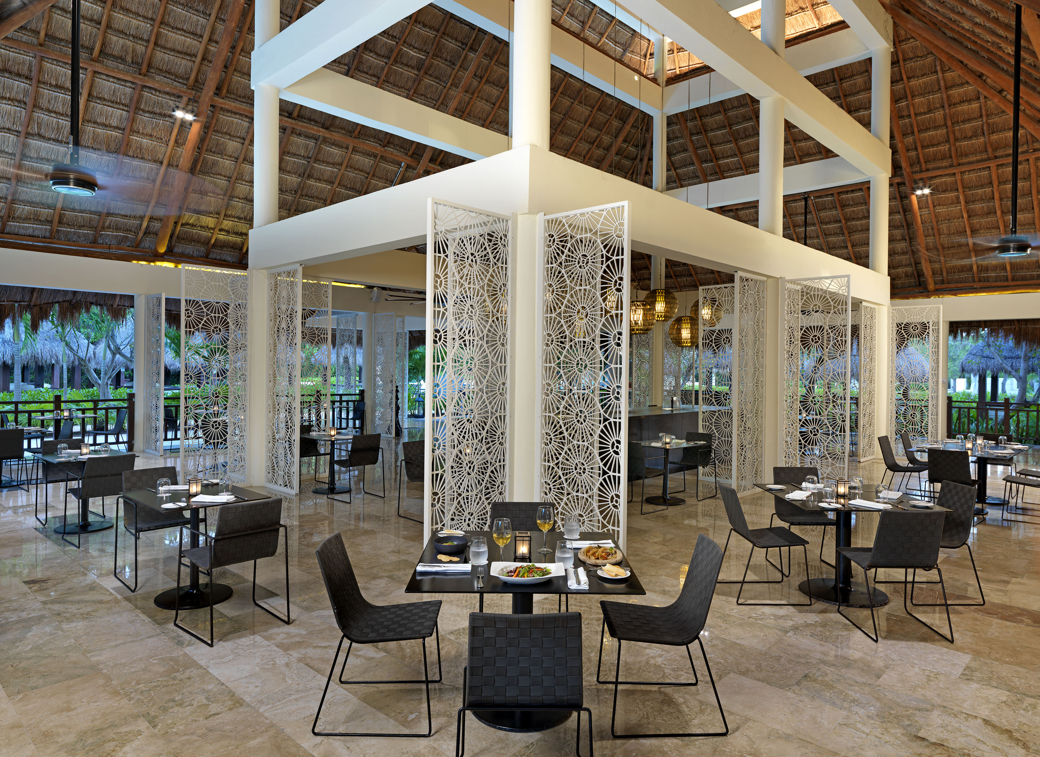 a restaurant with tables and chairs