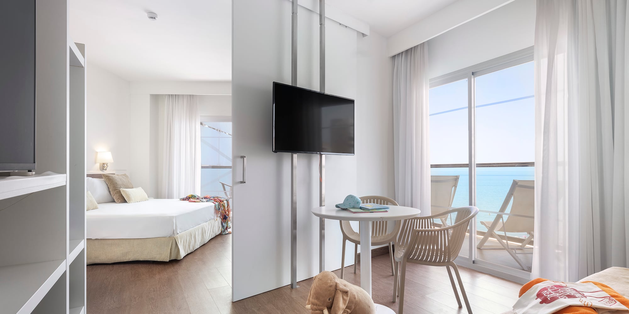 a room with a television and a bed