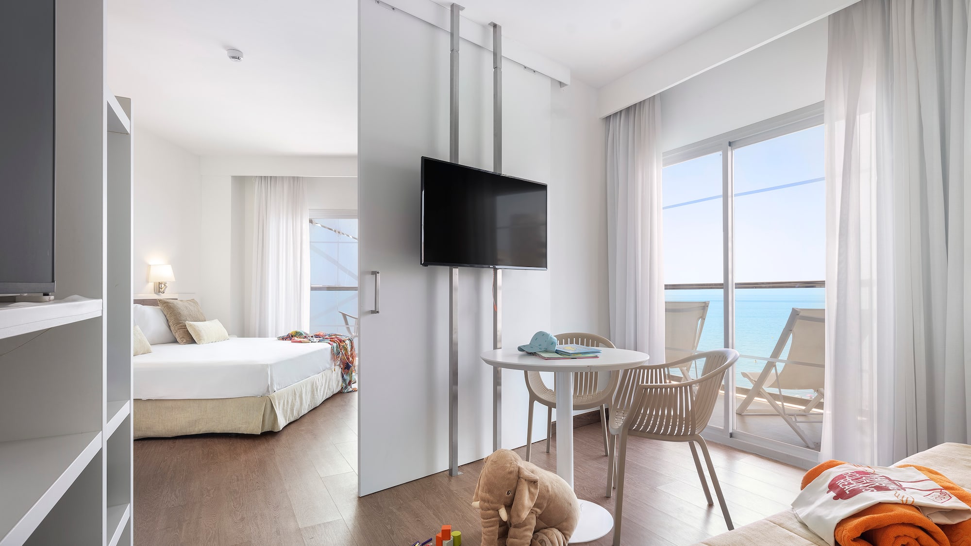 a room with a television and a bed