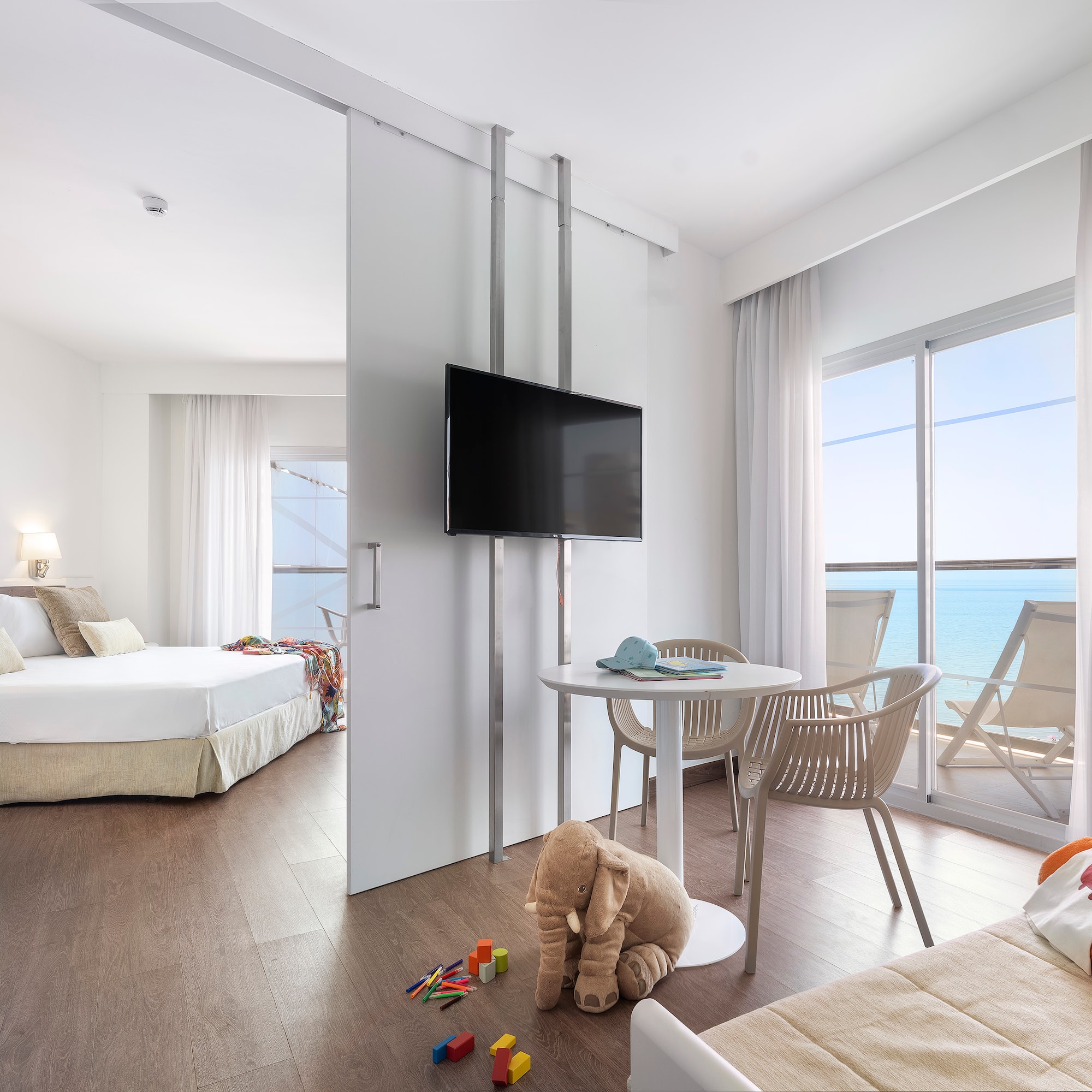 a room with a television and a bed