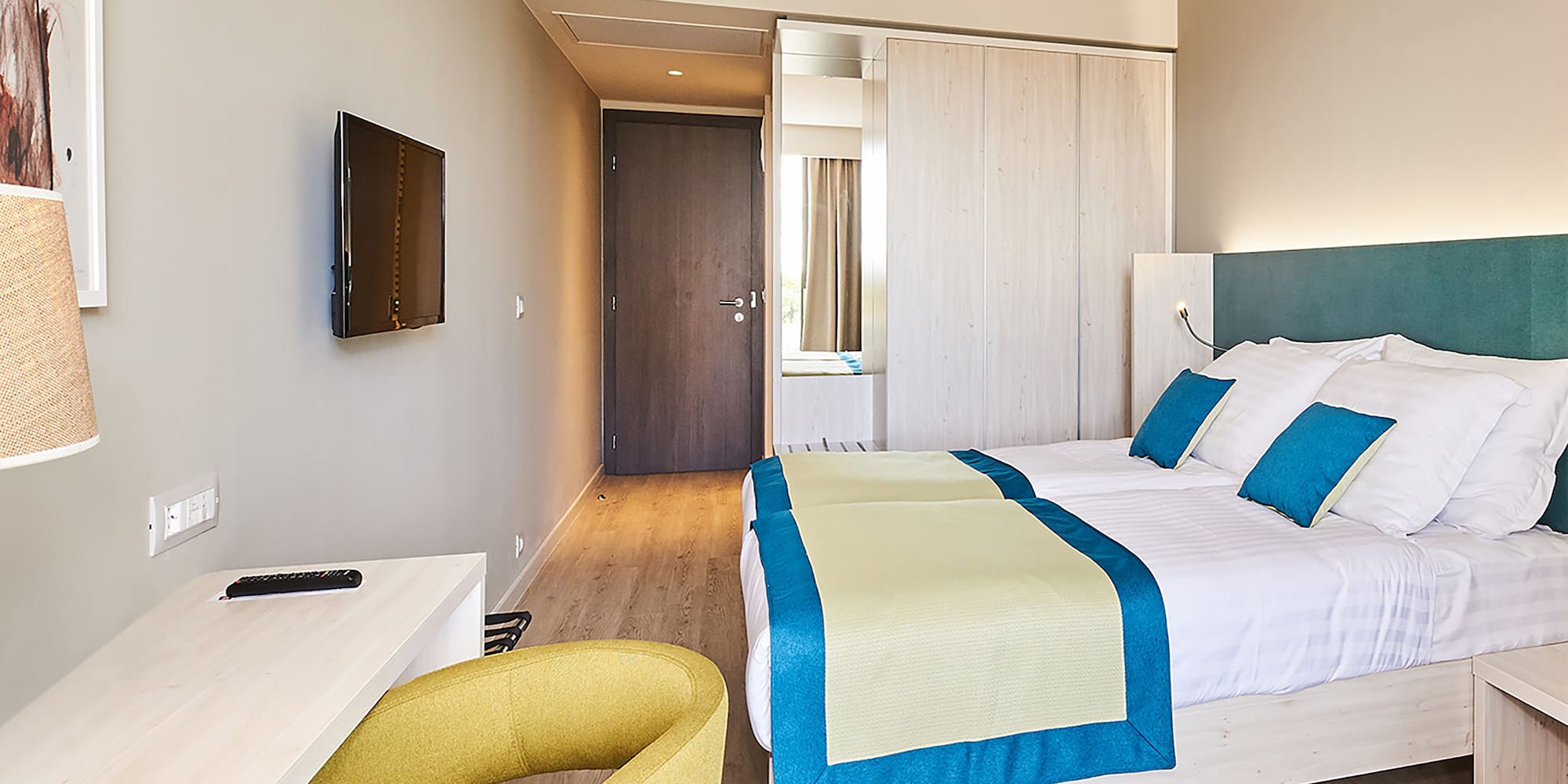 a room with a bed and a desk