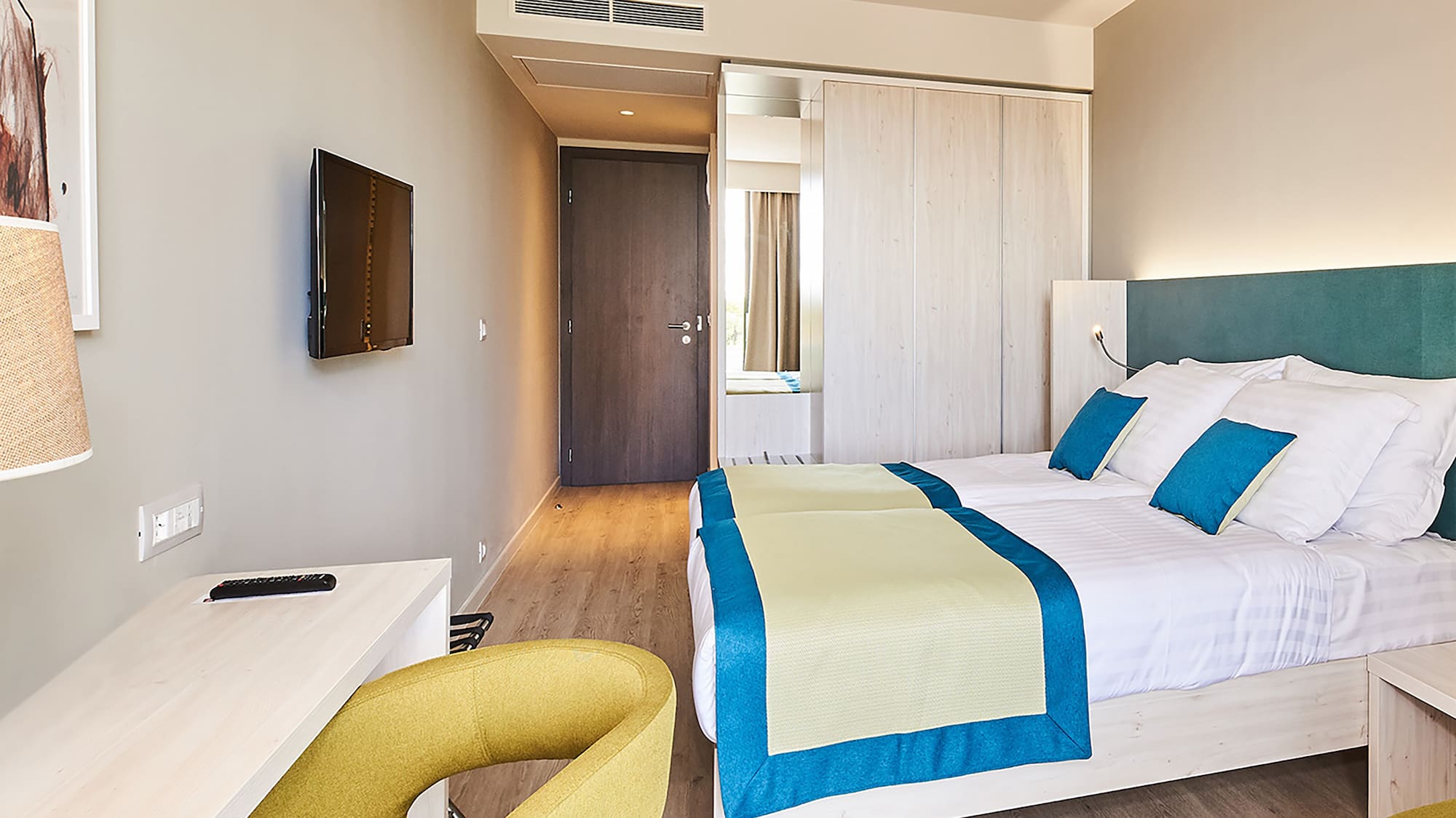 a room with a bed and a desk