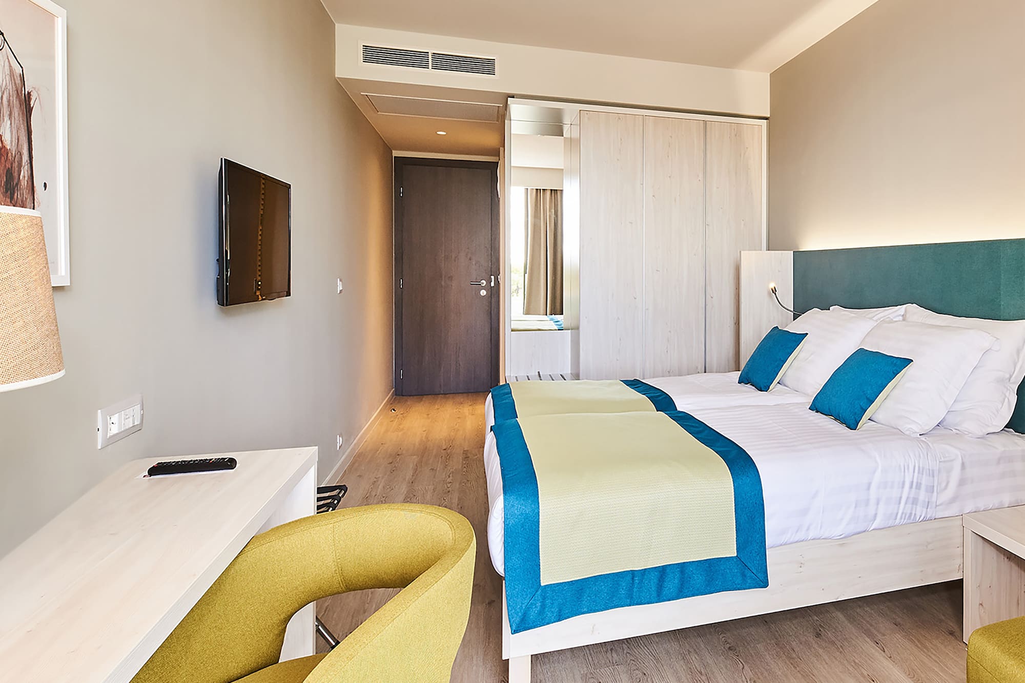 a room with a bed and a desk