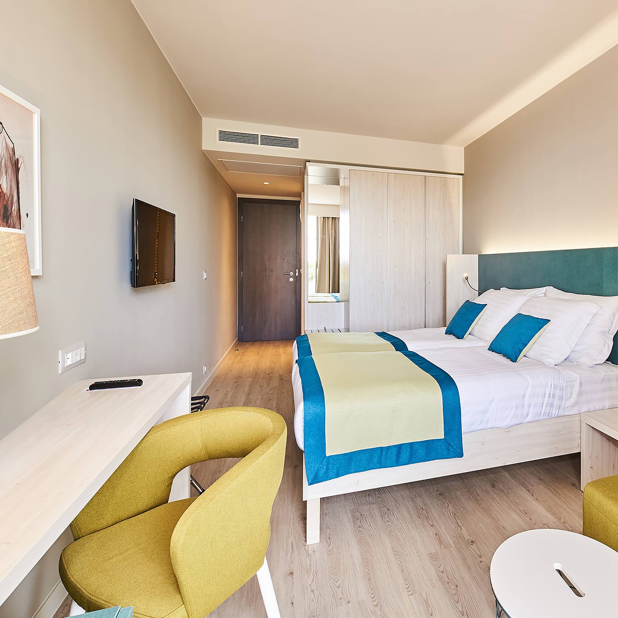 a room with a bed and a desk