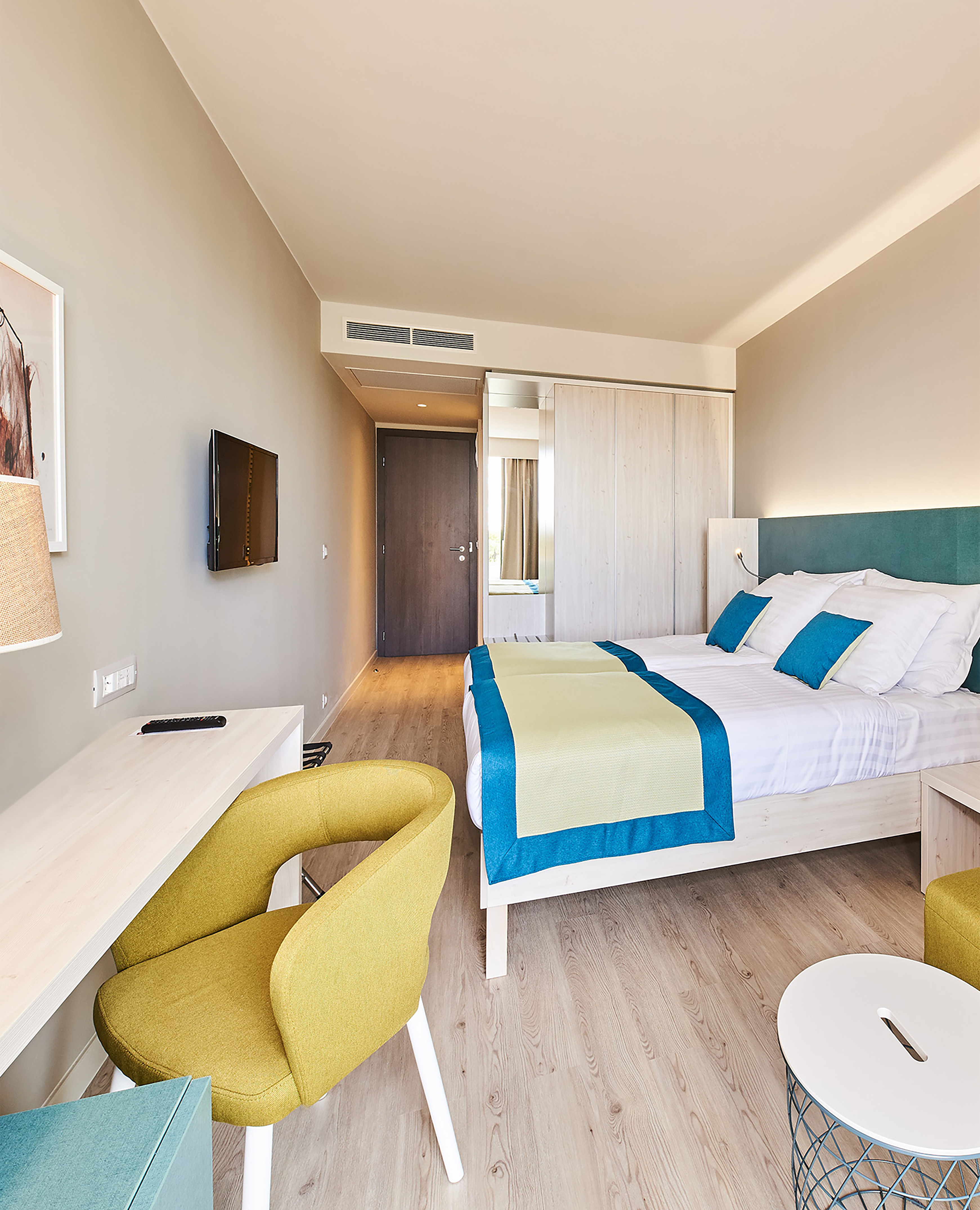 a room with a bed and a desk