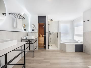 a bathroom with a tub and sink