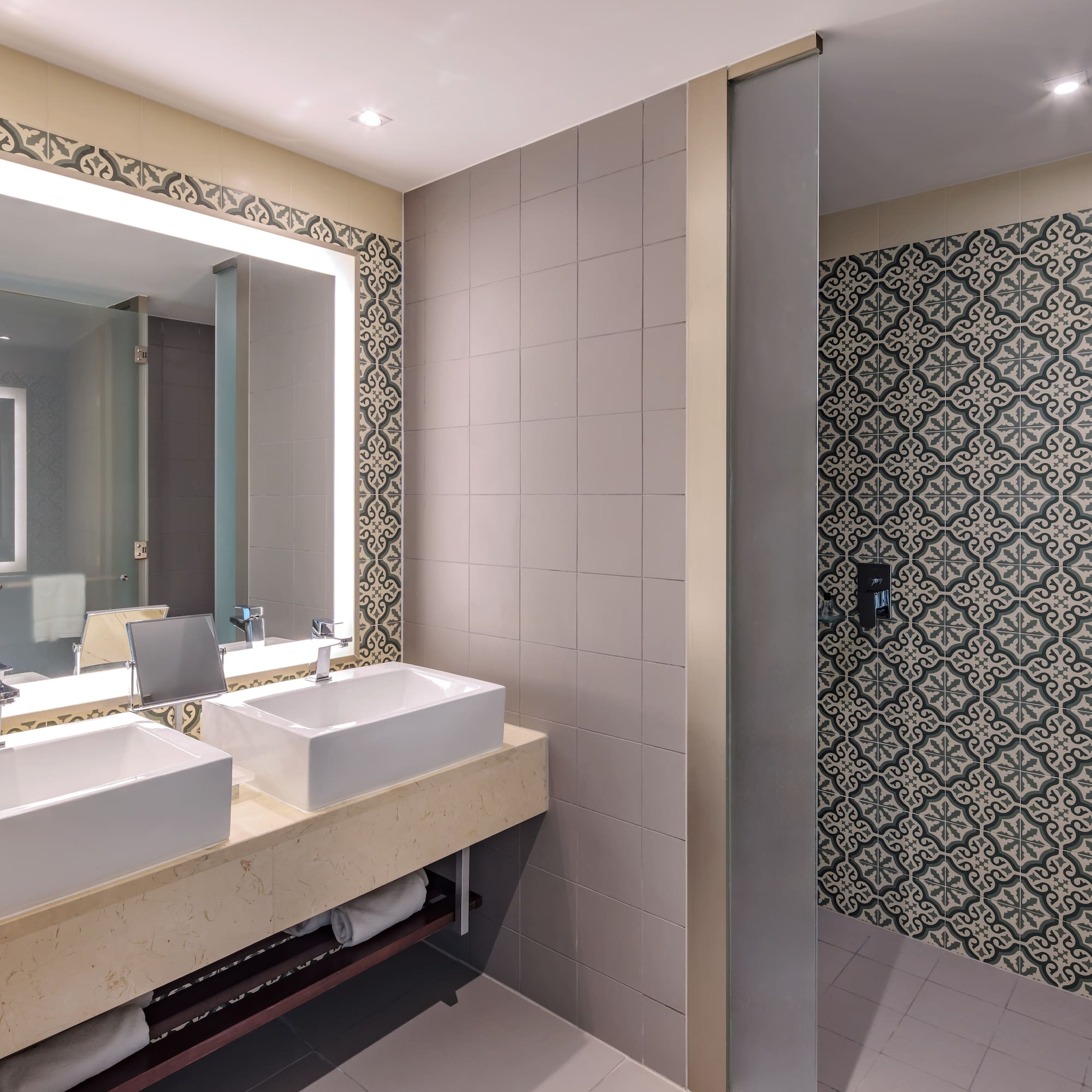 a bathroom with sinks and a mirror