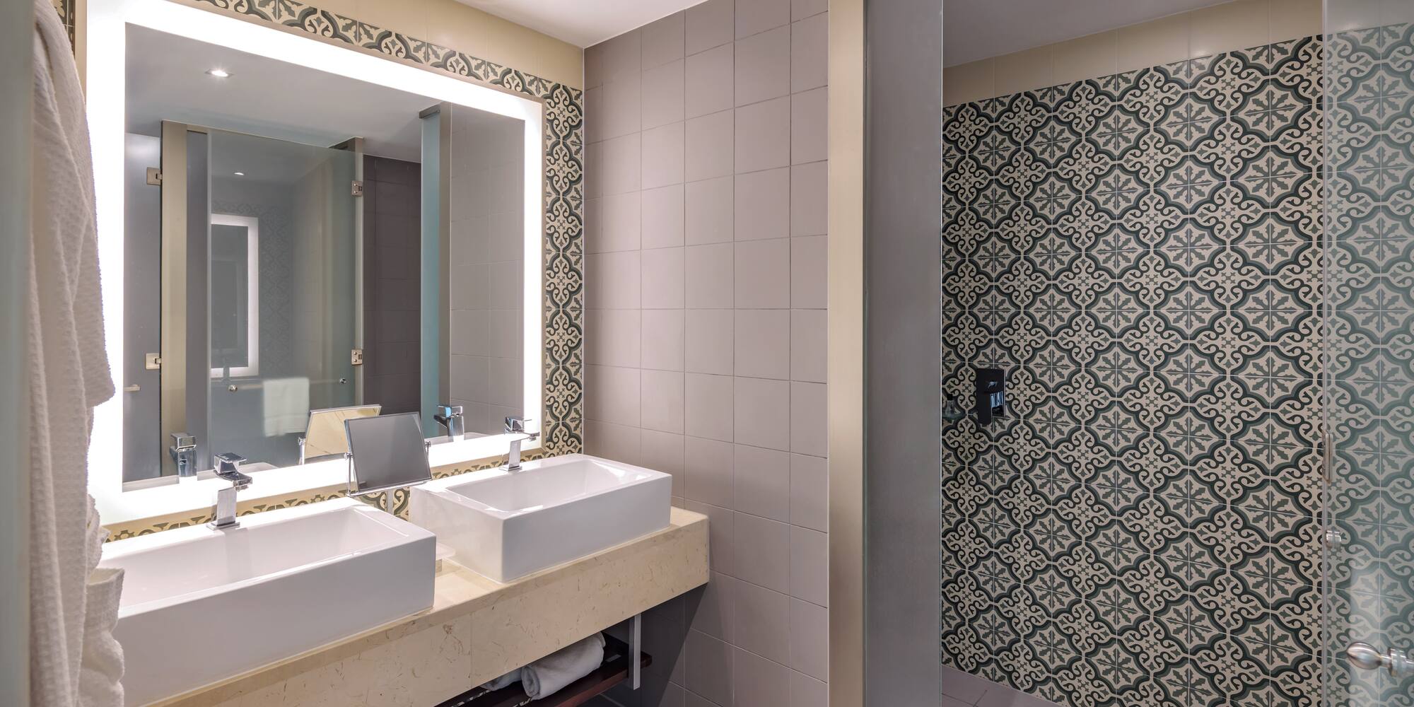 a bathroom with sinks and a mirror