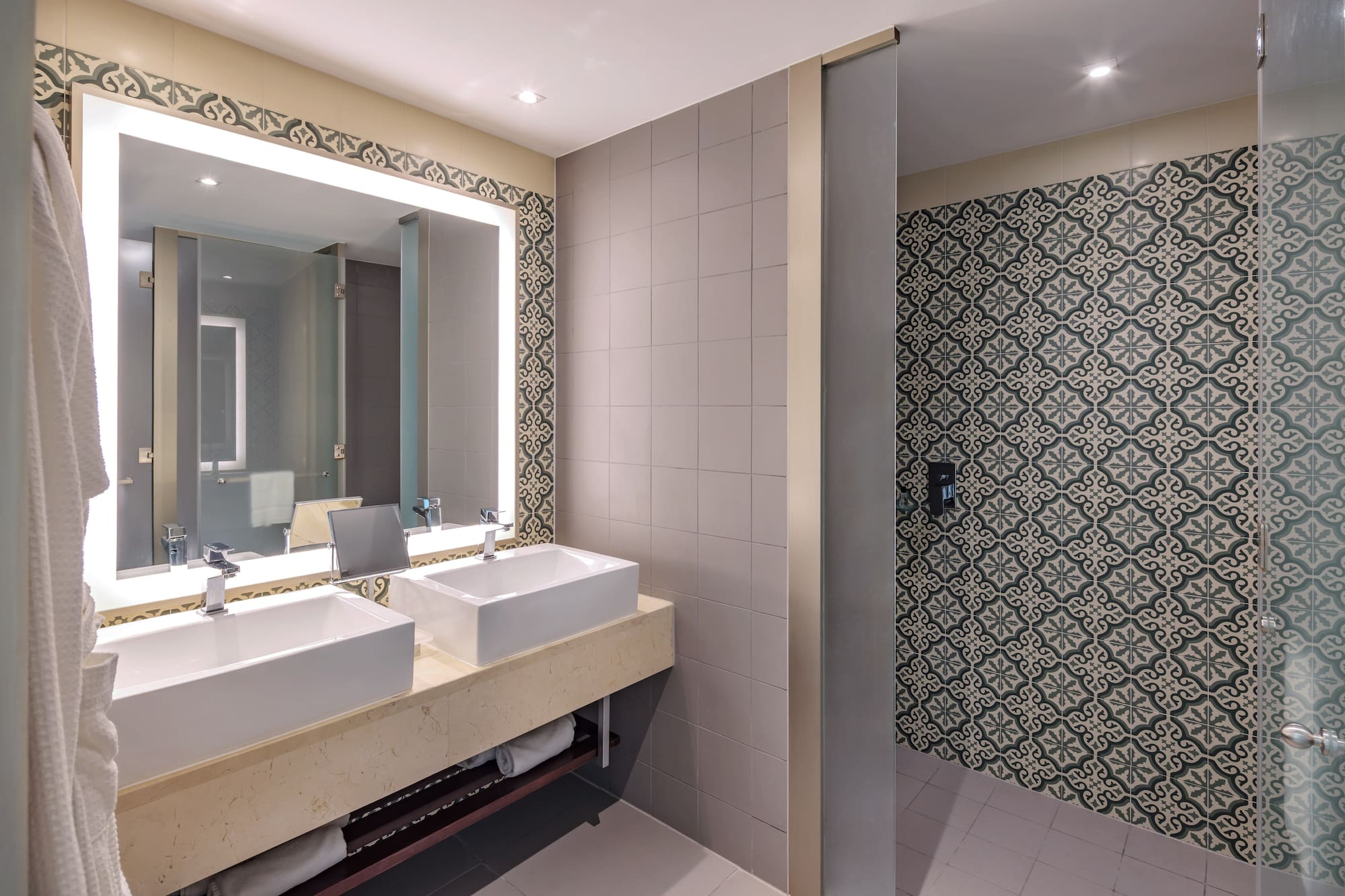 a bathroom with sinks and a mirror