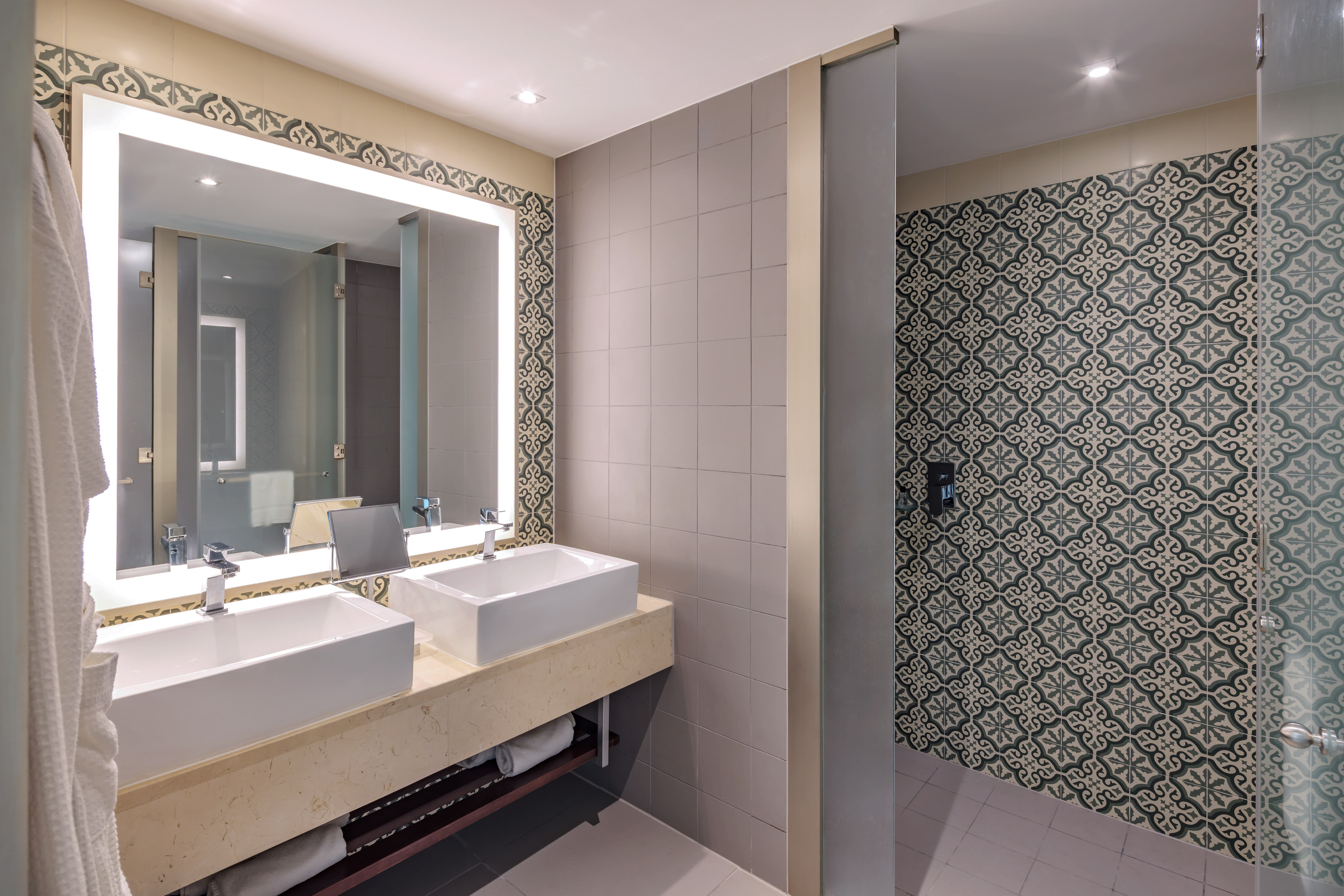 a bathroom with sinks and a mirror