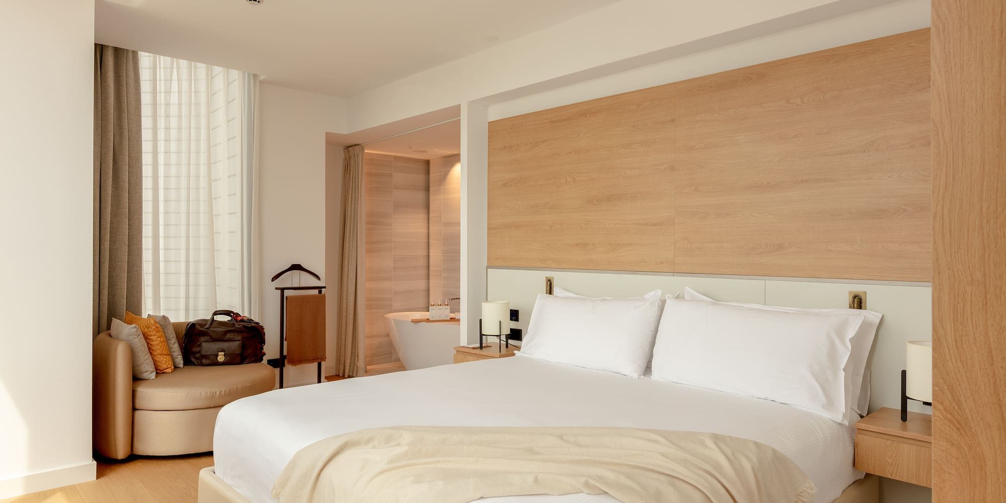 a hotel room with a bed and a tub