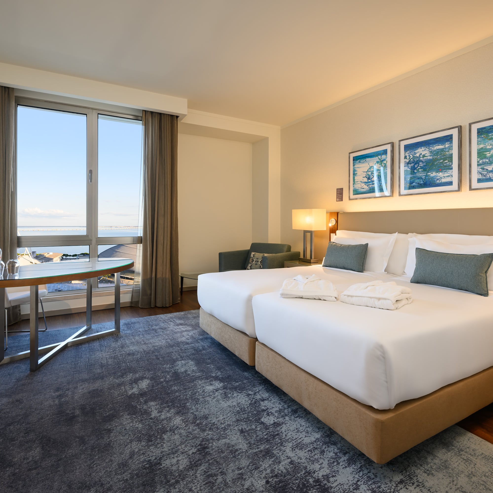 a hotel room with a bed and a table