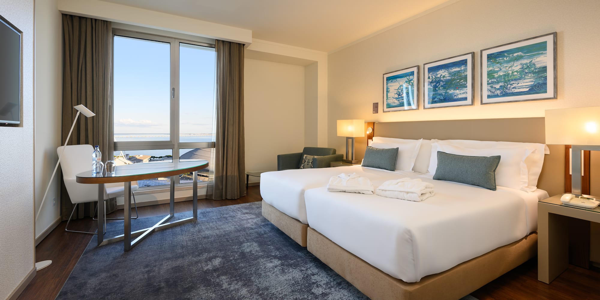 a hotel room with a bed and a table