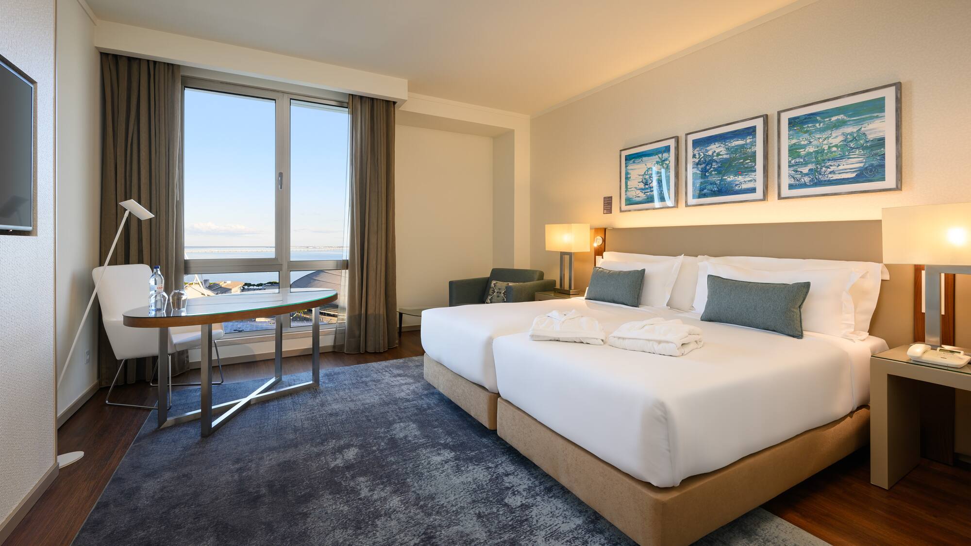 a hotel room with a bed and a table