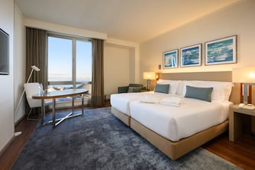 a hotel room with a bed and a table