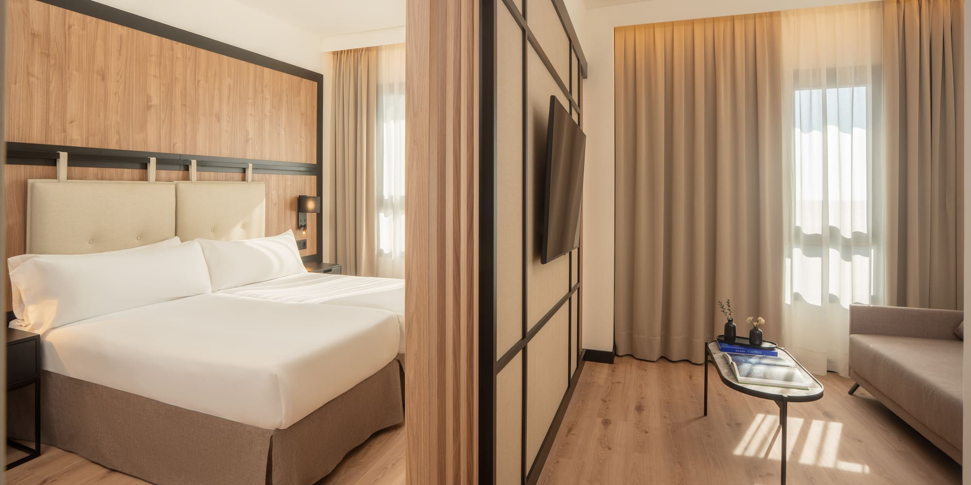 a room with a bed and a tv