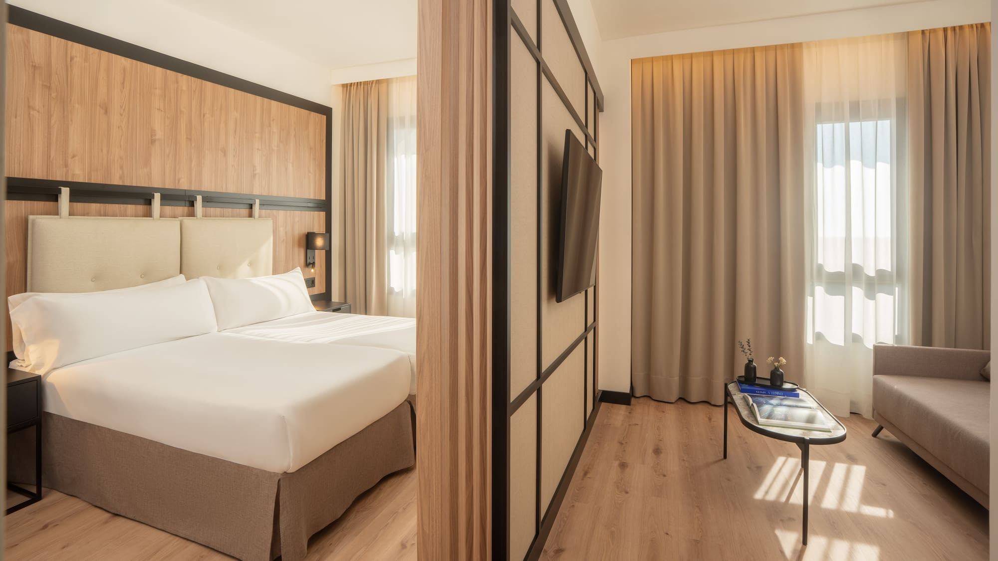 a room with a bed and a tv