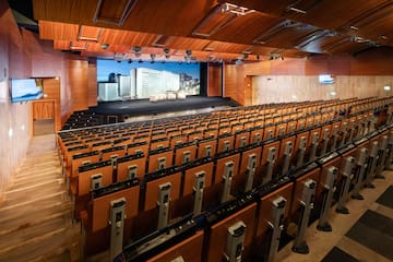 a large auditorium with rows of seats