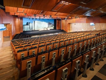a large auditorium with rows of seats