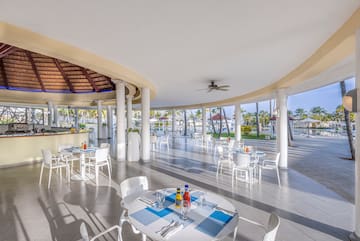 a large room with tables and chairs