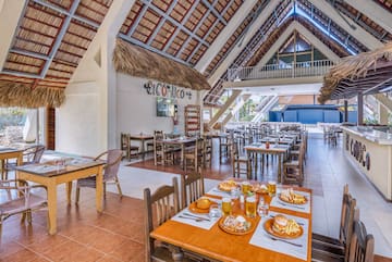a restaurant with tables and chairs