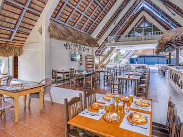 a restaurant with tables and chairs