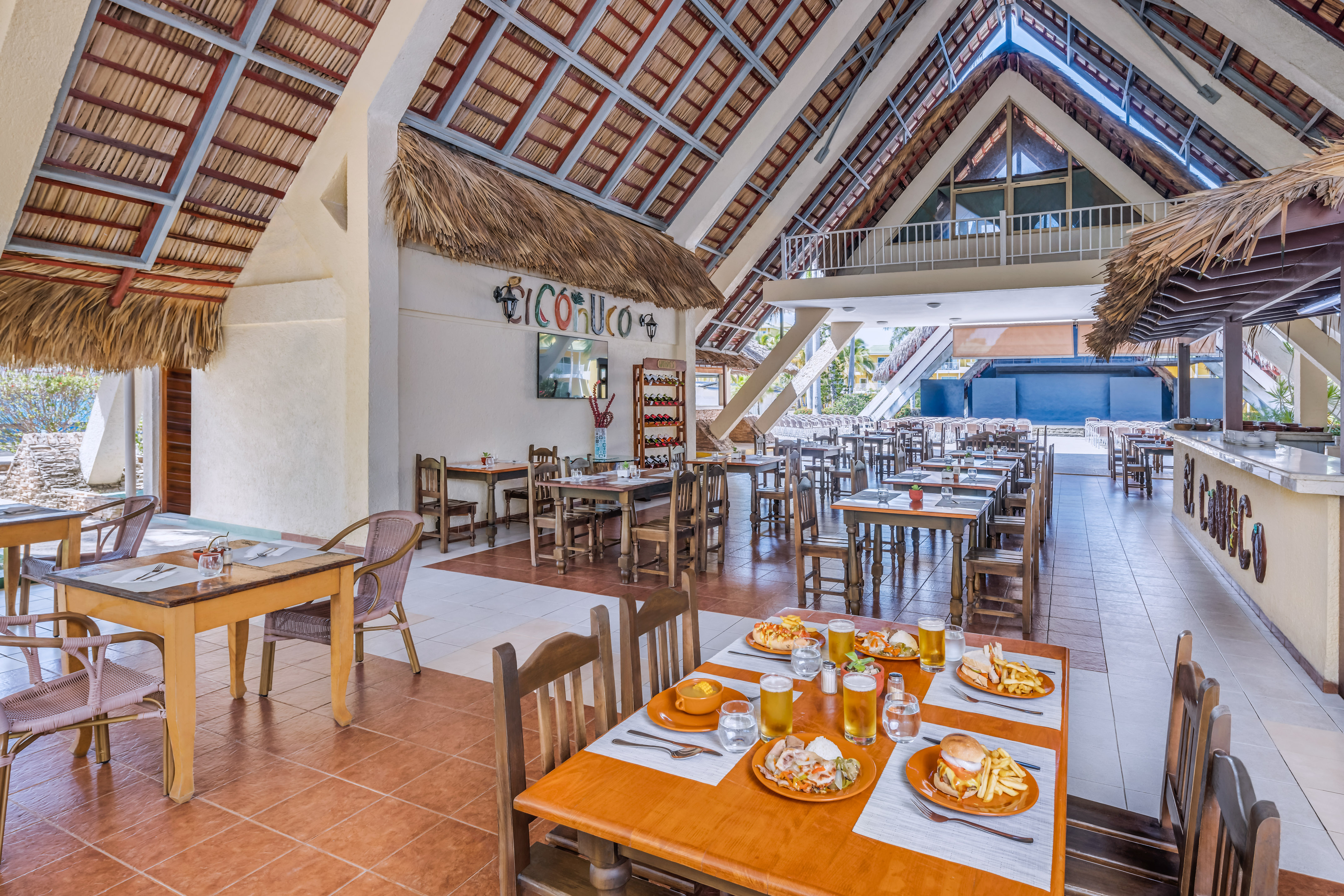 a restaurant with tables and chairs