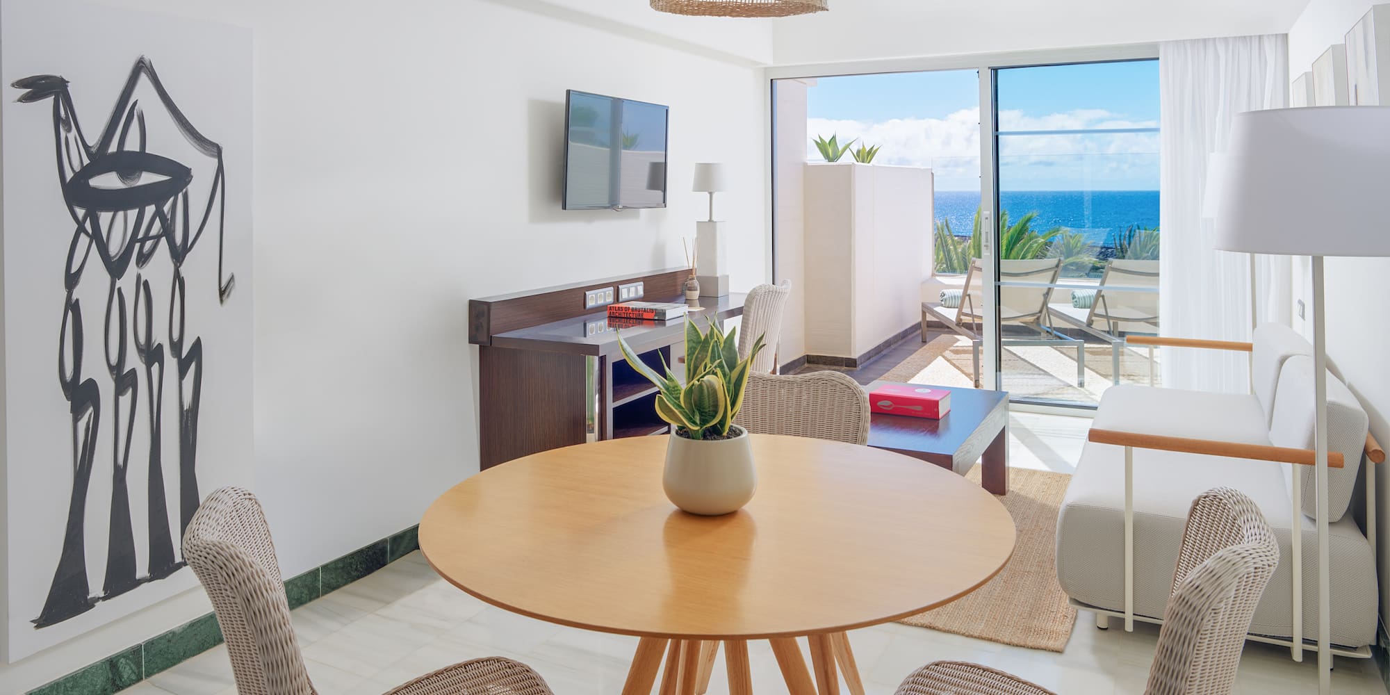 a room with a table and chairs