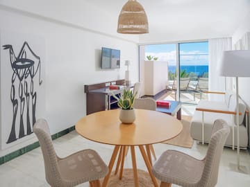 a room with a table and chairs