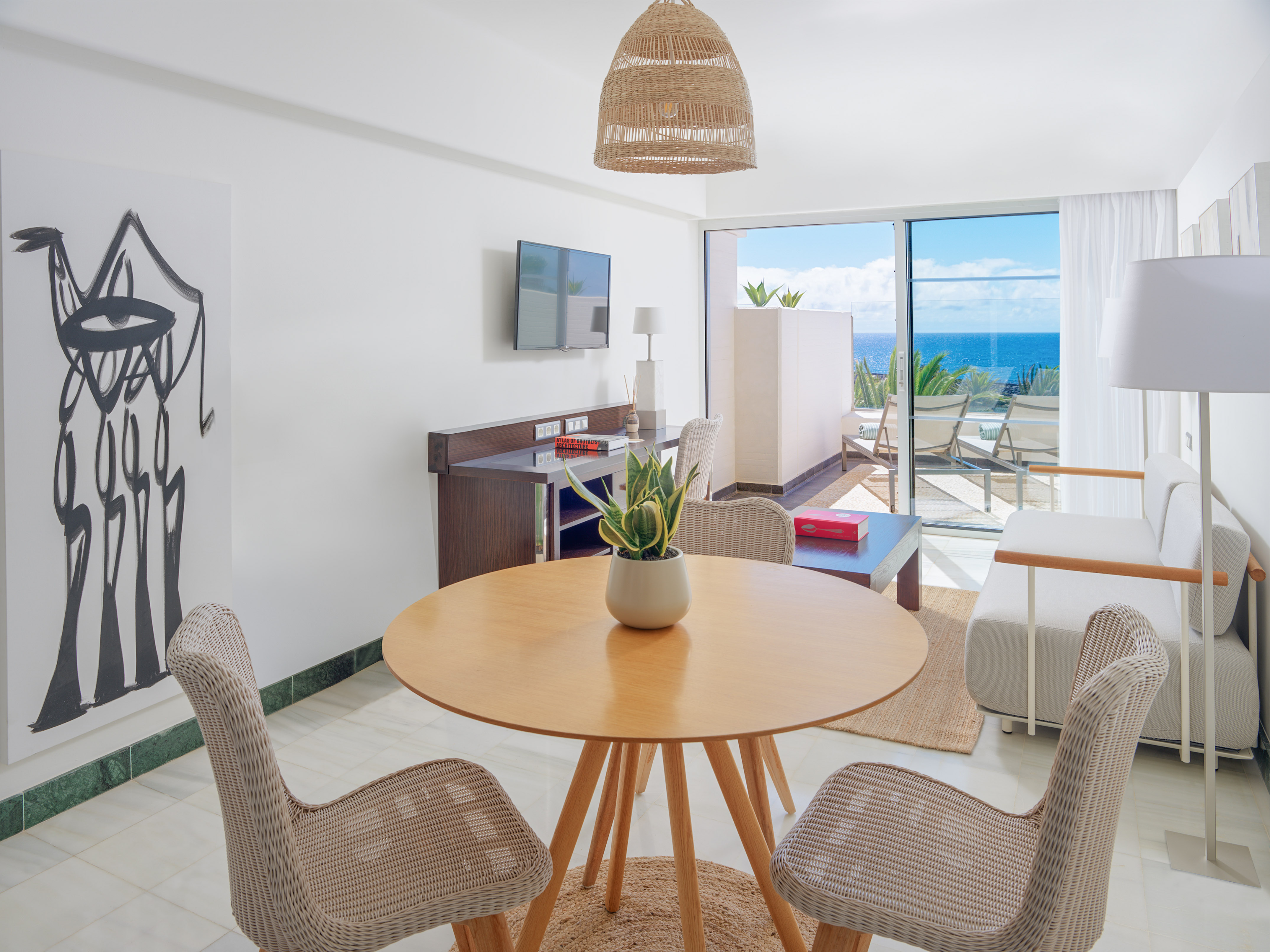 a room with a table and chairs