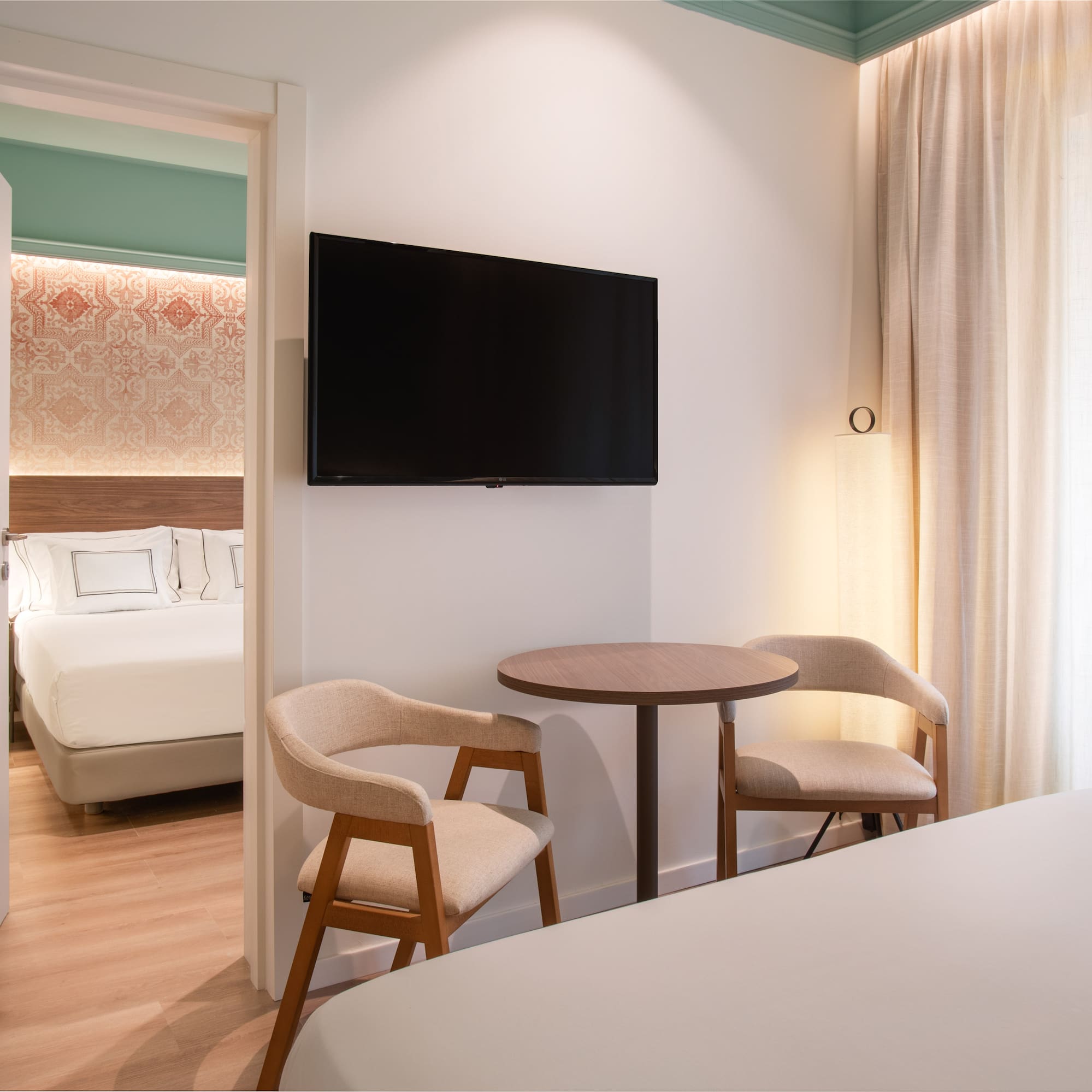 a room with a tv and a bed