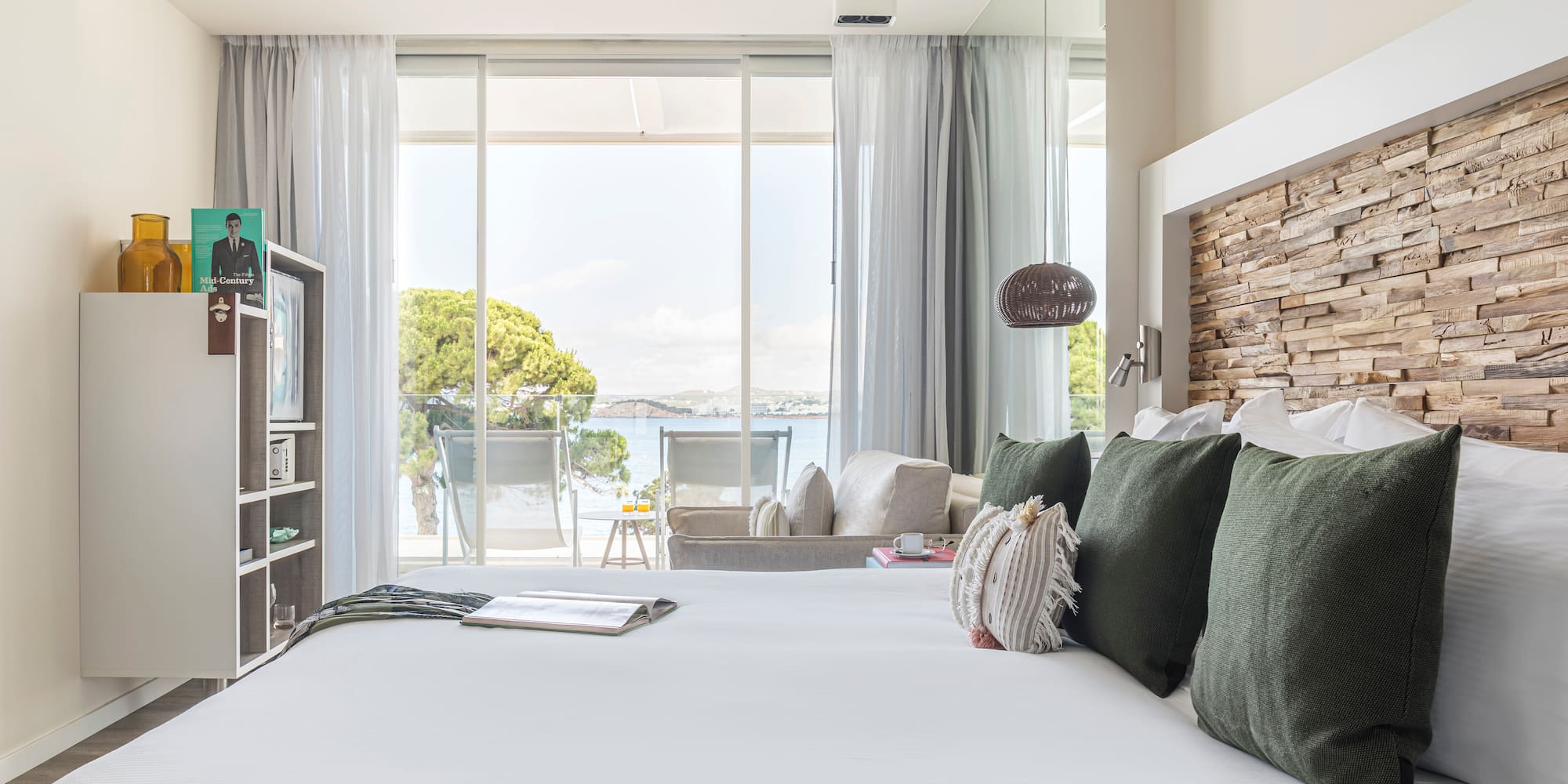 a bed with pillows and a book on it